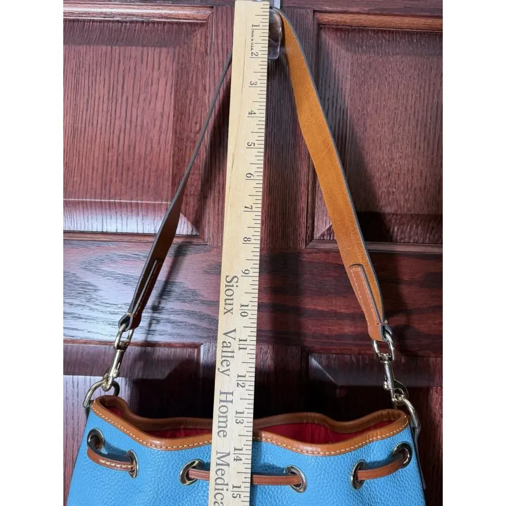 Dooney & Bourke Pebble Grain Drawstring Bucket Bag Blue Leather Red Interior